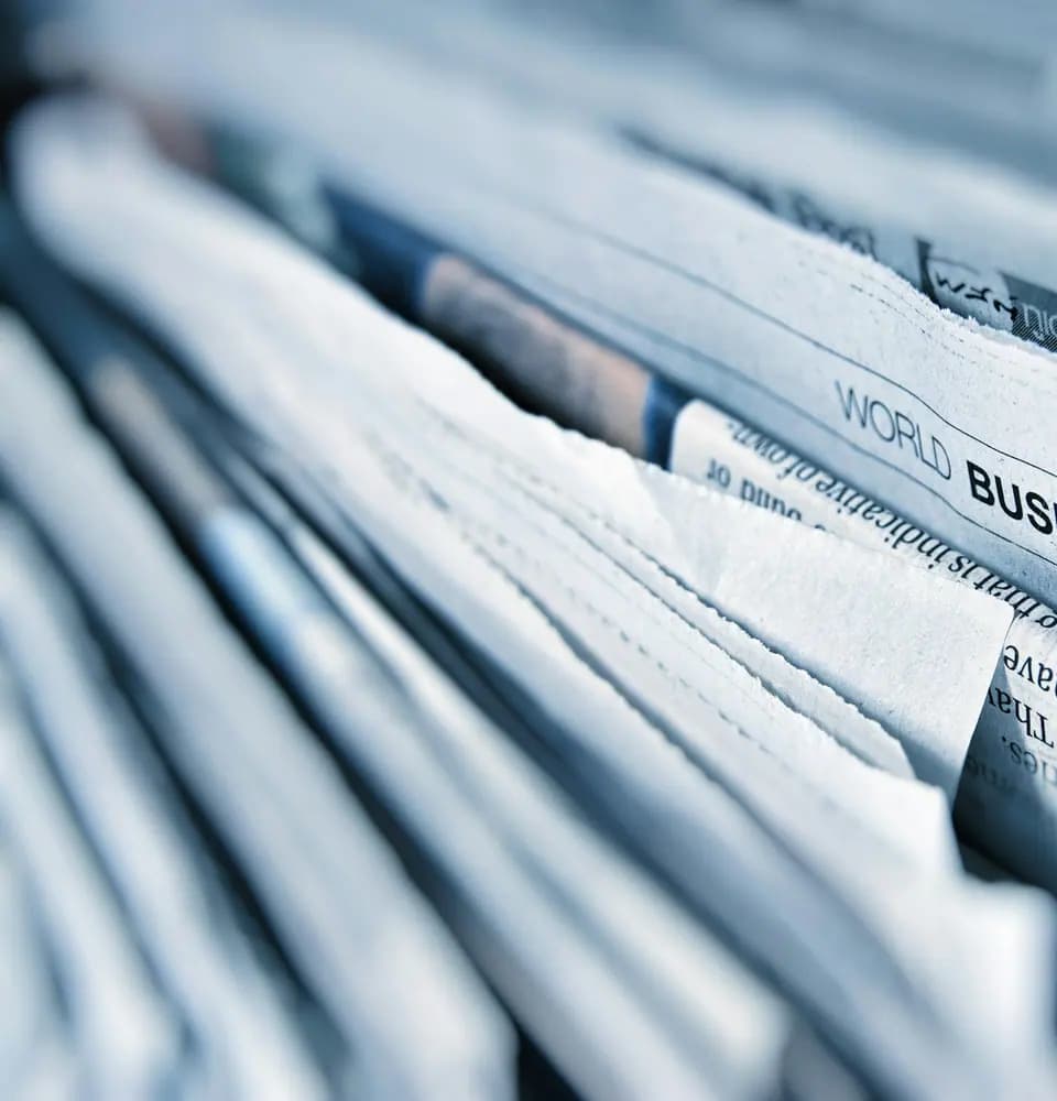 Stack of newspapers representing digital PR and media placements