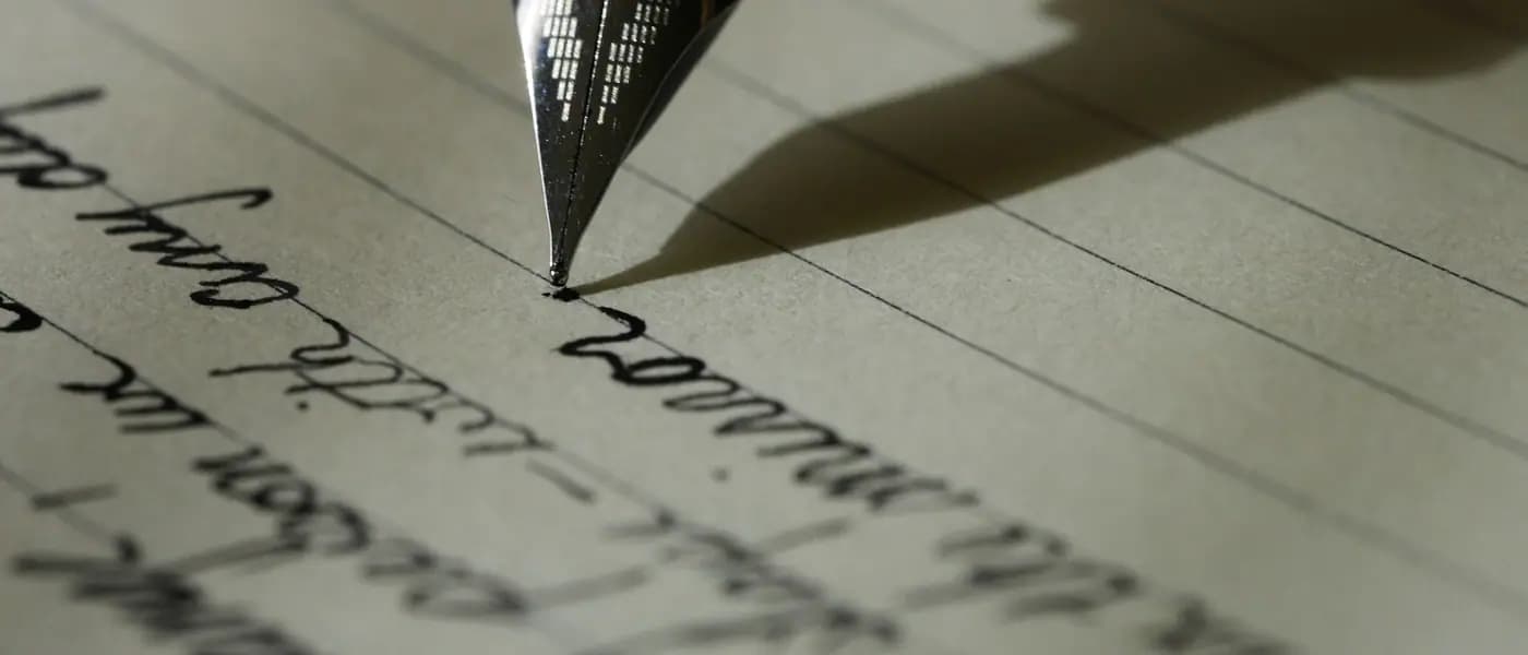 Fountain pen writing on paper for press release distribution services